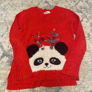 Girls justice red sweater, with panda that has flip sequin antlers